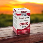 JutaVit Szerves Cink 25 mg - 100 db doboza fa asztalon, naplementés háttér előtt